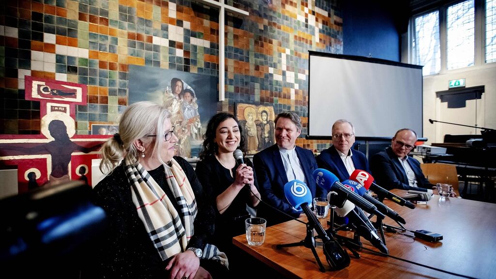 Armenian Hayarpi Tamrazyan (second left) speaks during a press conference in Bethel Church on Wednesday after a continious church services was stopped. Photograph: Robin Van Lonkhuijsen/AFP/Getty Images