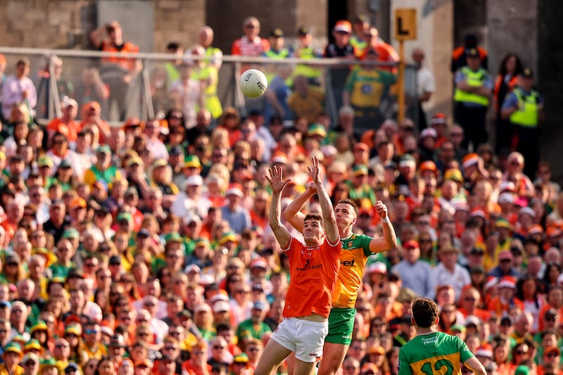Armagh's Jarly Og Burns competes in the air with Donegal's Jason McGee in Clones at the weekend. Photograph: Ben Brady/ Inpho