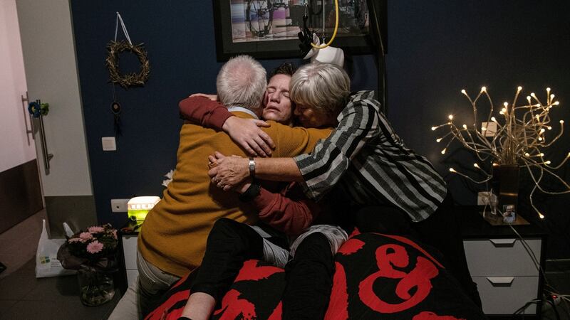 Marieke Vervoort embraces her parents, Odette Pauwels and Jos Vervoort, before her euthanasia, at her home in Diest, Belgium, October 22nd, 2019. Photograph: Lynsey Addario/New York Times