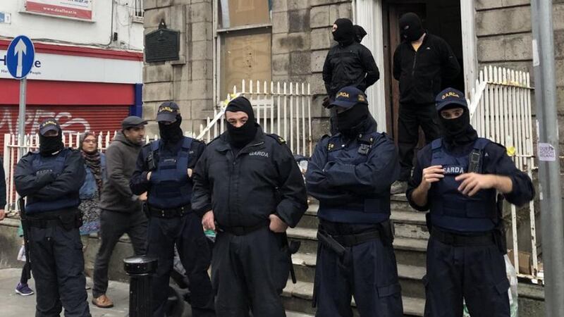 Gardaí were deployed to keep protesters and the masked men apart. Photograph: Jack Power