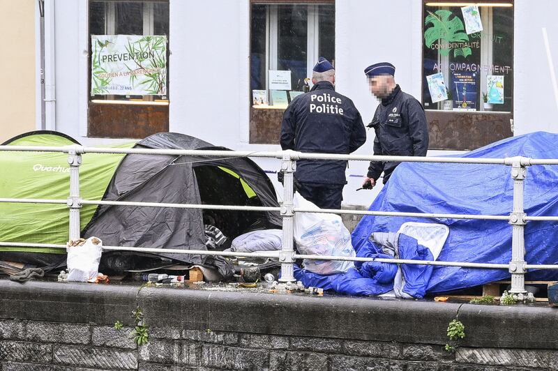 Belgian police move in to break up the tent encampment in Brussels. Photograph: Laurie Dieffembacq/AFP via Getty
