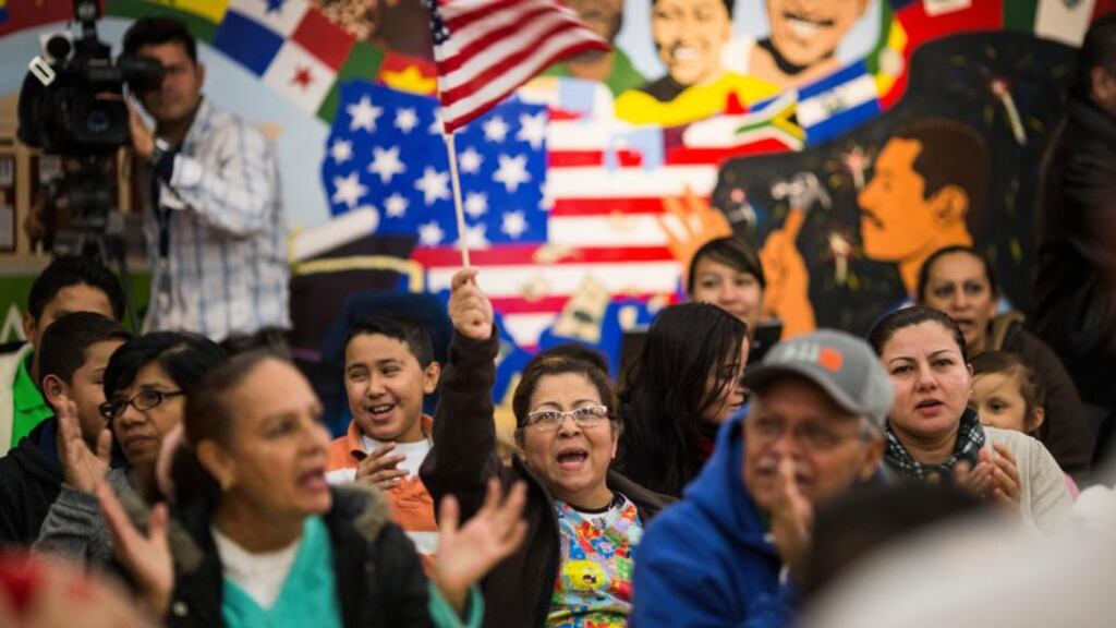 People react positively at a watch party as US president Barack Obama outlines his executive actions on immigration in a televised address at Casa de Maryland in Hyattsville, US. Photograph: Jabin Botsford/ New York Times