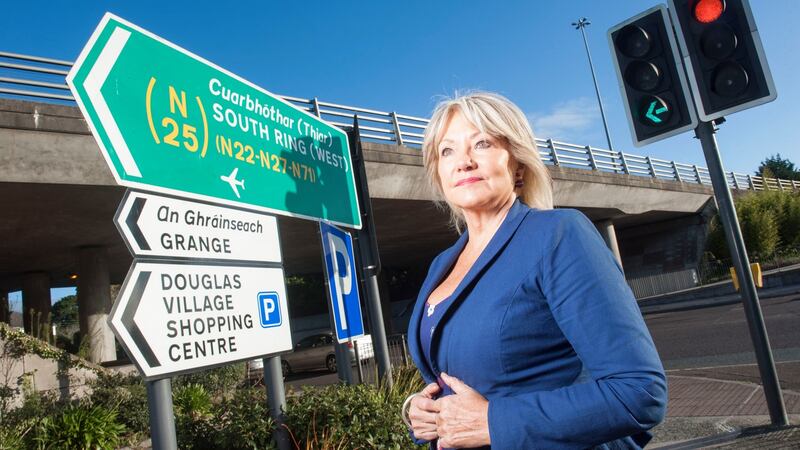 Fine Gael councillor Deirdre Forde at the current boundary line between Cork city and county in Douglas village. Photograph: Provision