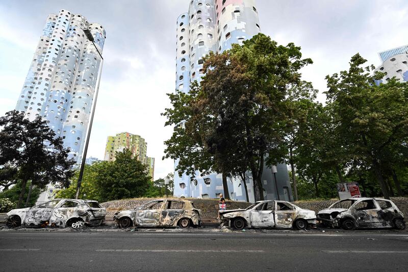 Burnt cars line the street at the foot of the Pablo Picasso estate in Nanterre, west of Paris on June 30th. Photograph: Bertrand Guay/AFP via Getty