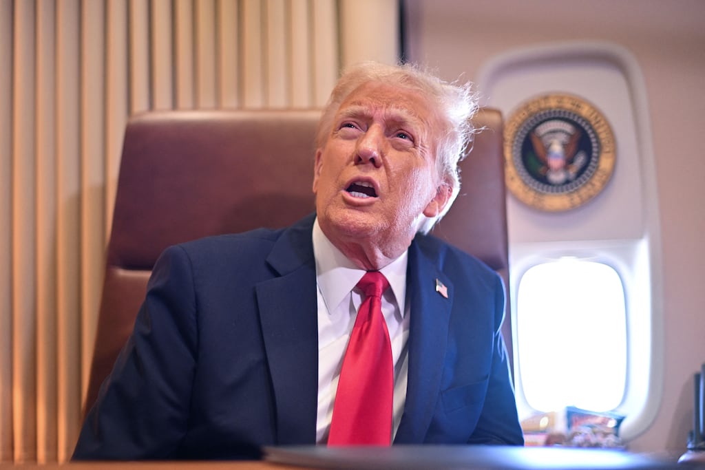 US president Donald Trump speaks to the press on board Air Force One. Photograph: Roberto Schmidt/AFP/Getty