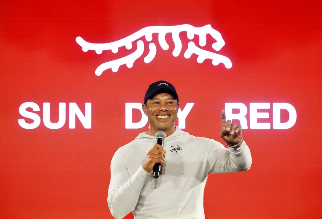 Tiger Woods speaks during the launch his new apparel and footwear brand Sun Day Red with TaylorMade Golf. Photograph: Kevork Djansezian/Getty Images