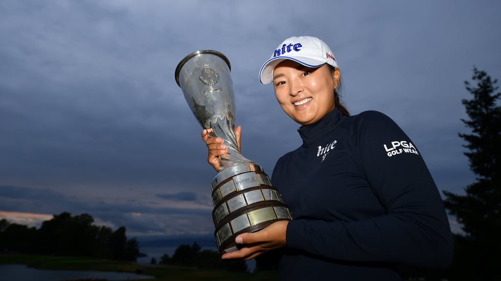 Ko Jin-young of South Korea with the trophy at Evian-les-Bains in France. Photograph: Stuart Franklin/Getty Images