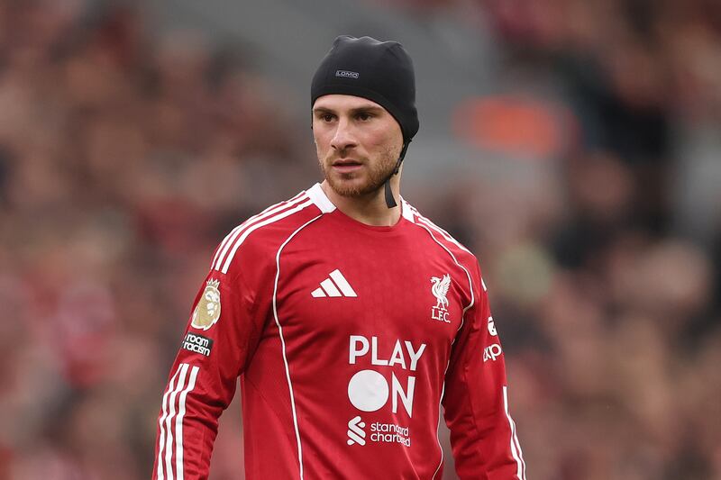 Alexis MacAllister had to wear protective covering on his head after an early collision in Liverpool's defeat by Manchester United. Photograph: Carl Recine/Getty Images