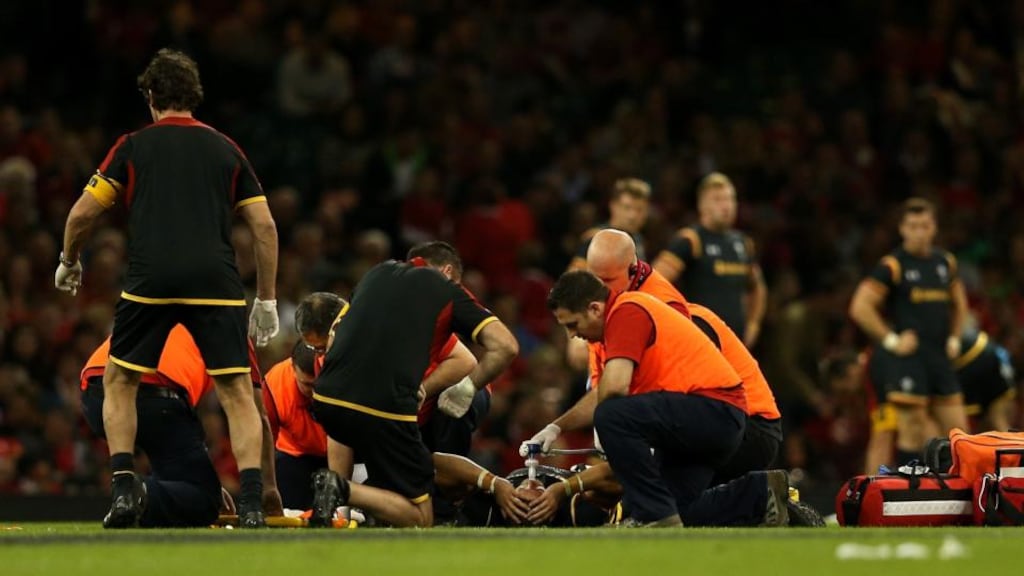 Leigh Halfpenny of Wales receives medical treatment after suffering an ACL injury during the World Cup warm-up against Italy at the Millennium Stadium in Cardiff. Photograph: Dan Mullan/Getty Images