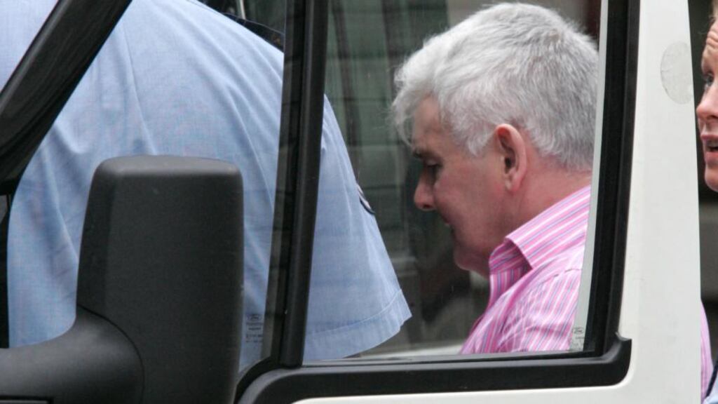 John Gilligan is taken by gardaí from the High Court in 2010. Photograph: Cyril Byrne/The Irish Times
