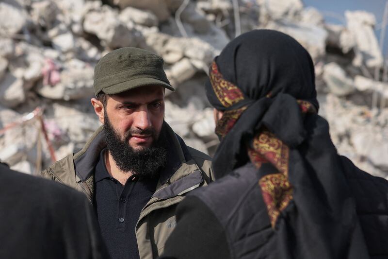 Ahmed al-Sharaa, then known by his nom d guerre Abu Mohamed al-Jolani, checks the damage following an earthquake in the village of Besnaya in Syria's rebel-held northwestern Idlib province in 2023. Photograph: Omar Haj Kadour/AFP via Getty Images