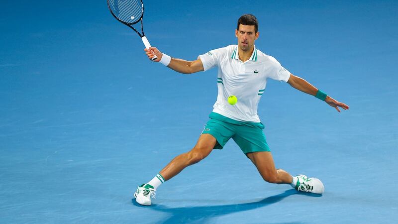 Djokovic hits a return. Photo: Brendan Malone/AFP via Getty Images