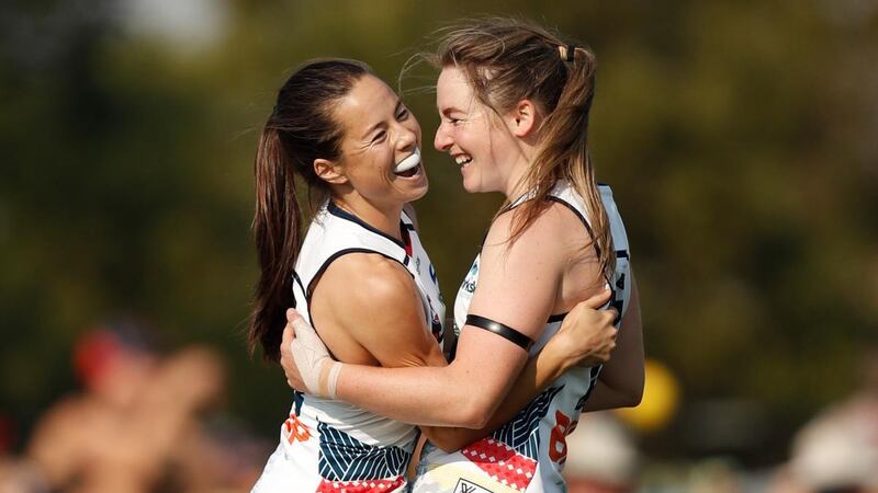 Sophie Li and Ailish Considine of the Adelaide Crows celebrate during an AFLW game against the Melbourne Demons on March 16th. Photograph: Michael Willson/AFL Media