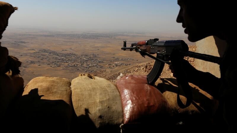 Iraqi Kurdish Peshmerga fighters hold a position on the top of Mount Zardak, about 25km east of Mosul, October 6th, 2016. Photograph: Safin Hamed/AFP/Getty Images
