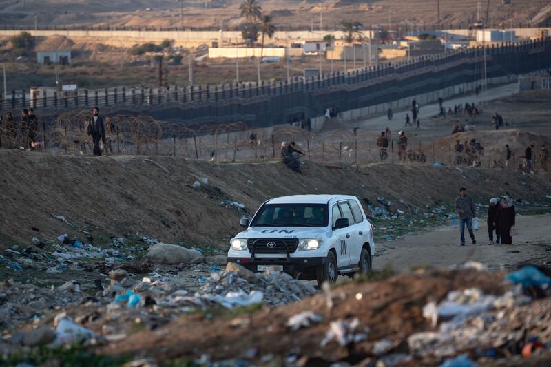 A Unrwa vehicle transits past displaced Palestinians walking near the Palestinian-Egyptian border in Rafah camp, southern Gaza Strip on January 29th. Photograph: Haitham Imad/EPA-EFE