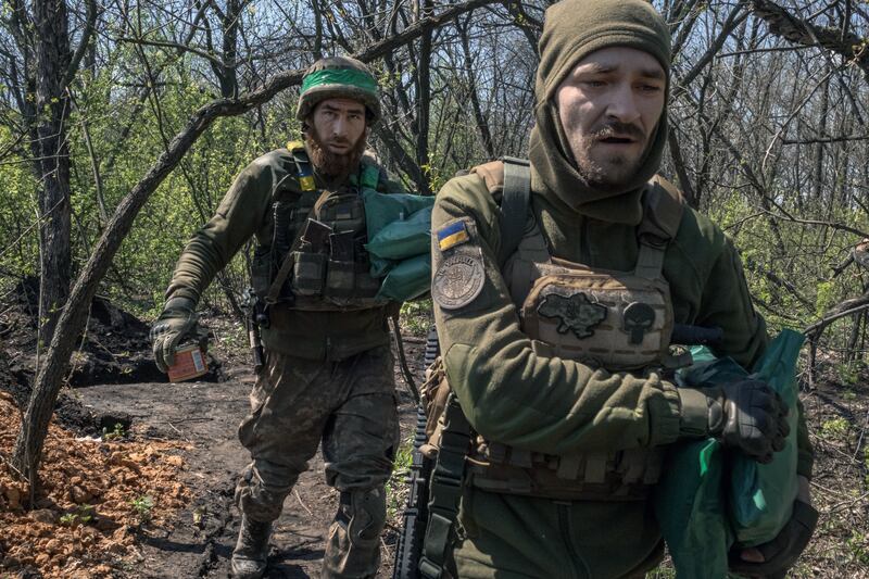 Ukrainian soldiers carry food supplies for their comrades at a frontline position near Ivanivske, eastern Ukraine, on April 26th last,. Ukrainian media reports have pointed to overpayments for basic supplies for the army, such as food and winter coats. Photograph: Mauricio Lima/New York Times