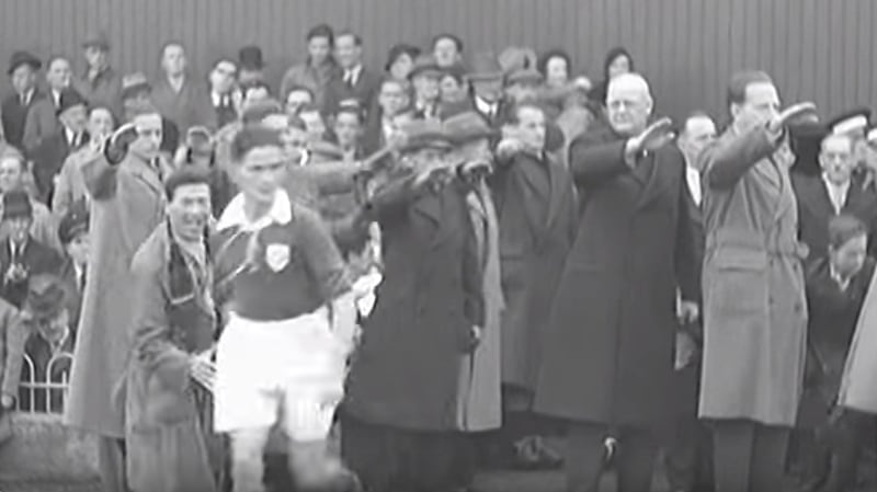 German dignitaries raise their right hands at Dalymount Park as the Ireland team runs out.