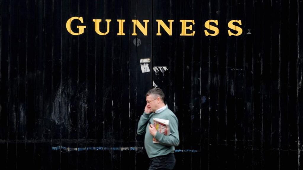 A pedestrian passes the entrance to the Guinness brewery, operated by Diageo´, in Dublin. Photograph: Aidan Crawley/Bloomberg