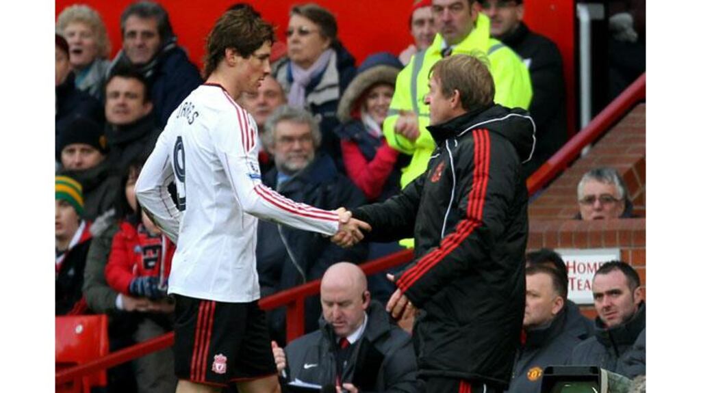 Liverpool Manager Kenny Dalglish shakes hands with Fernando Torres as he substitutes him during the FA Cup match against Manchester United at Old Trafford (Photograph: Alex Livesey/Getty Images)