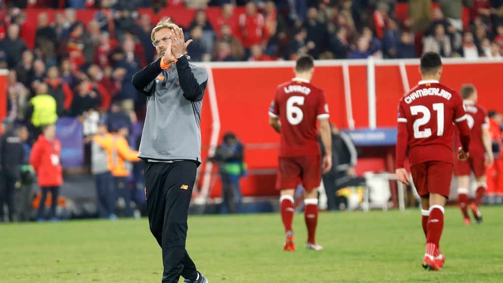 Liverpool coach Jurgen Klopp applauds their travelling supporters at the Ramon Sanchez Pizjuan stadium. Photograph: PA