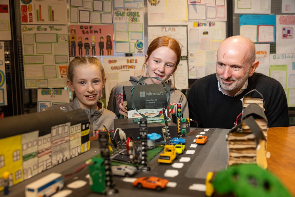 Microsoft Ireland site leader and corporate vice-president James O’Connor with Eibhlín and Róisín, sixth class students at St Mary’s National School, Longford, at the Microsoft Dream Space Showcase. Photograph: Naoise Culhane
