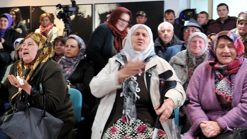 Bosnian Muslim women, survivors of the Srebrenica 1995 massacre,  at the Srebrenica memorial in Potocari on Wednesday, where they watched a live television broadcast of the sentencing for war crimes of former Bosnian Serb leader Radovan Karadzic.  Photograph: Elvis Barukcic/AFP/Getty Images