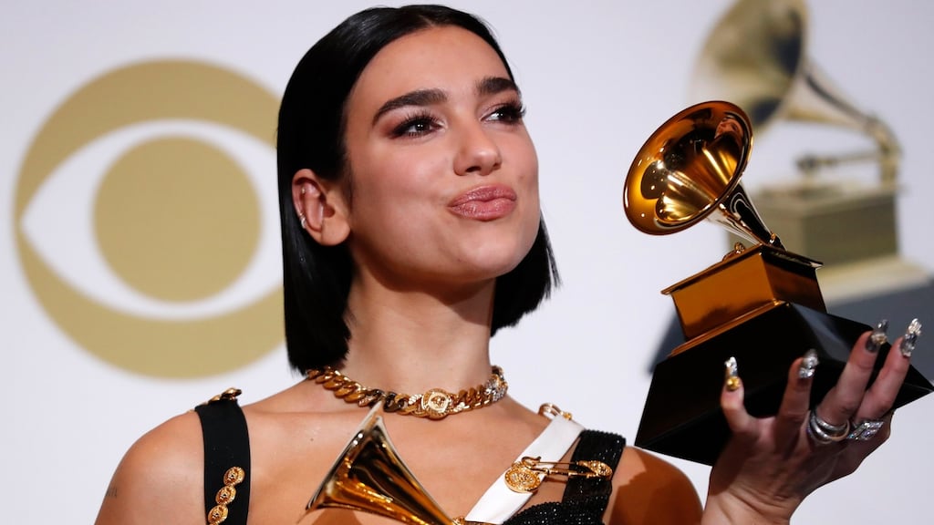 Dua Lipa poses backstage with her awards for Best Dance Recording for Electricity and for Best New Artist. Photograph: Mario Anzuoni/Reuters