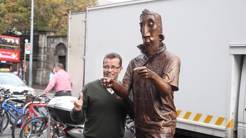 Author Paul Howard beside the Ross O’Carroll-Kelly statue at the bottom of Grafton St. Image: The Irish Times