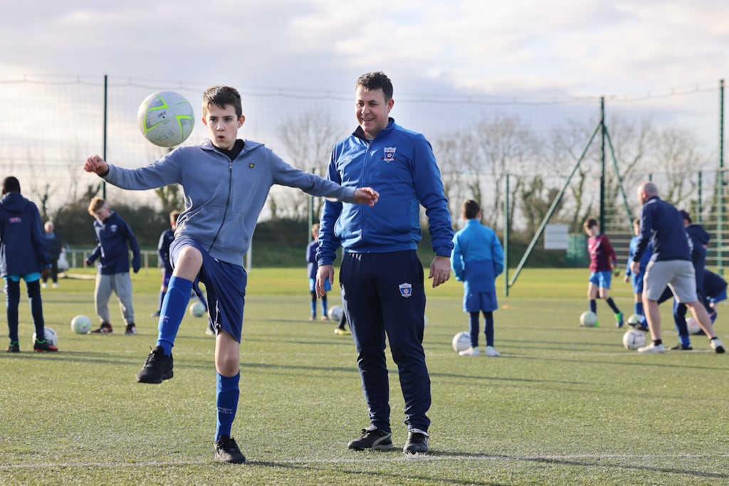 Football For All: Coach Phil Pierce and his son William, who is part of the team at East Meath United. Photograph: Dara Mac Dónaill