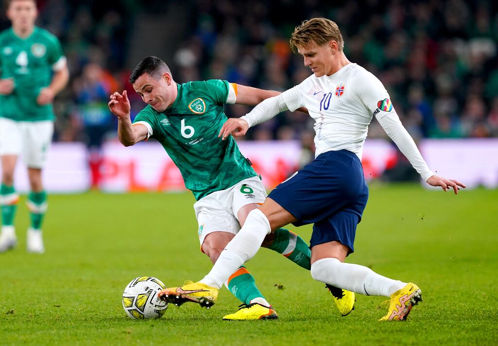 Josh Cullen challenges Norway's Martin Odegaard during the international friendly at the Aviva Stadium. Photograph: Brian Lawless/PA Wire