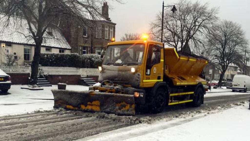 A snow plough clears the roads in Earsdon near Whitley Bay as snow and sleet will hit parts of north England today as freezing winds sweep across Britain. Photograph: PA