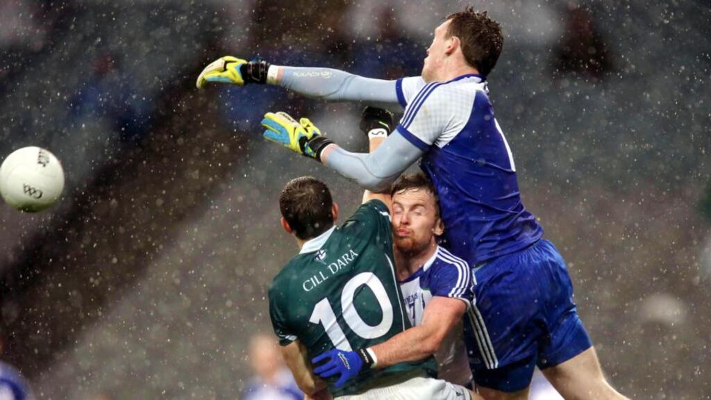 Monaghan goalkeeper Rory Beggan gets a leap over teammate Fintan Kelly and Kildare’s Cathal McNally during Saturday’s round 4B qualifier at Croke Park. Photograph: Ryan Byrne/Inpho