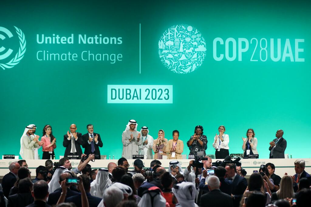 Delegates applaud after a speech by Sultan Ahmed Al Jaber, president of the Cop28 Climate Conference, which struck a deal on Wednesday. The agreement has received  a mixed reception from climate experts. (Photo by Fadel Dawod/Getty Images)