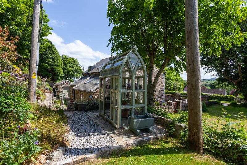 A potting shed was made using the old window frames