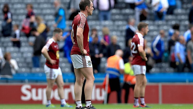 Westmeath players stand dejected at the end of the game. Photo: Donall Farmer/Inpho