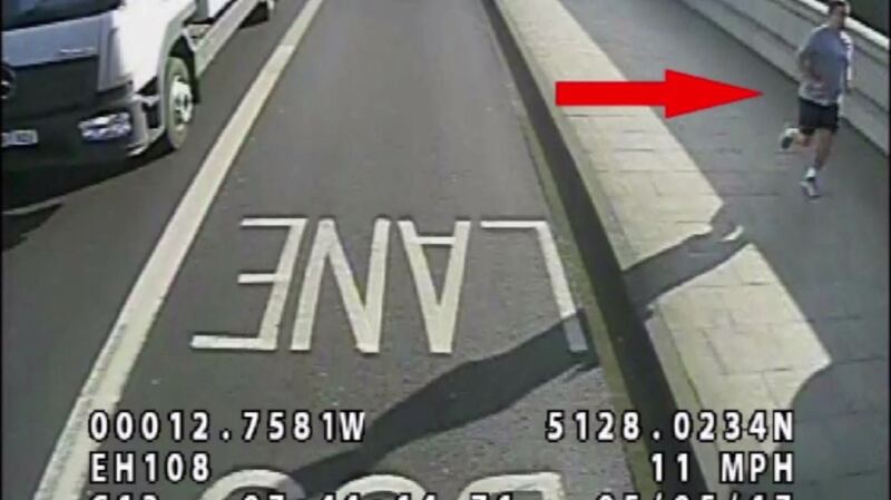 A handout photo made available by the London Metropolitan Police shows a jogger sought by police after he appeared to have pushed a woman into the path of an oncoming bus in Putney, London.