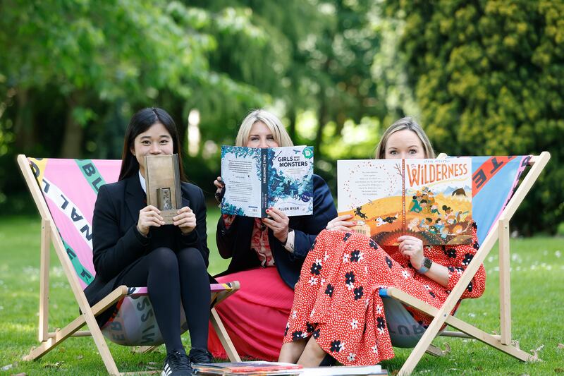 The six winners of this year’s KPMG Children's Books Ireland Awards were announced at a ceremony held in Merrion Square, as part of International Literature Festival Dublin. At the ceremony were Maria Flannery, KPMG Ireland Partner and accepting the Reading Hero Award on behalf of her sister, 13-year-old Shi Lei (Mila) Chen from Presentation Secondary School, Waterford, was Shi Rong Chen and Karina Howley, from KPMG. Photograph: Julien Behal