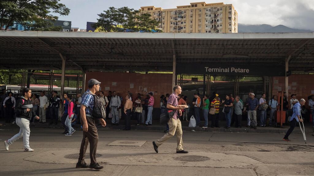 People wait for public transport while several areas remain without electric power, in Caracas on July 23rd. Photograph: Miguel Gutierrez/EPA