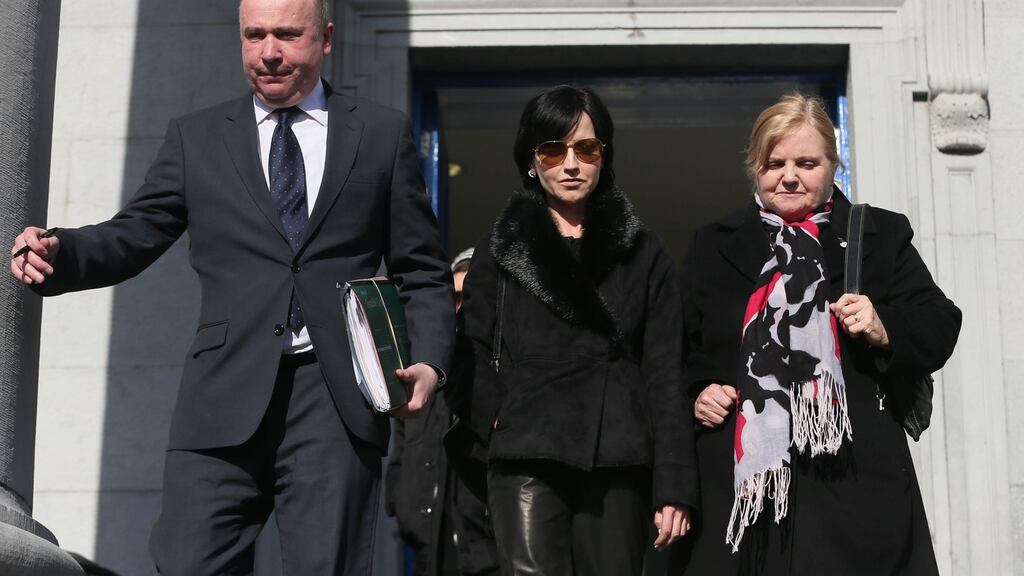 Cranberries singer Dolores O’Riordan (centre) leaves Ennis District Court last week flanked by her mother Eileen and solicitor Bill O’Donnell. Photograph: Niall Carson/PA Wire