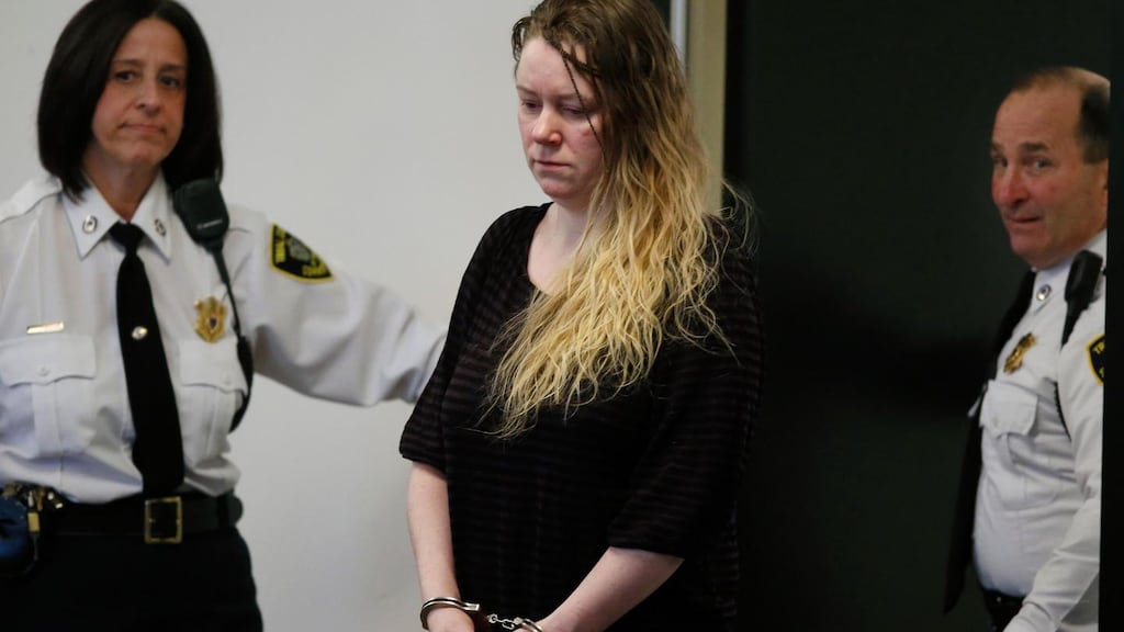 Court officers accompany Aisling Brady McCarthy, the Irish nanny charged with murder.