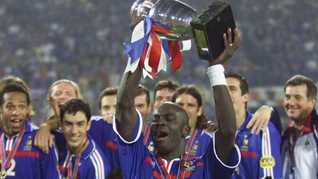 Lilian Thuram holds up the Euro 2000 trophy two years after he and his team-mates won the World Cup for France, a victory that was portrayed in the media as white, black and brown Frenchmen coming together to conquer the world. Photograph: Philippe Huguen/AFP/Getty Images