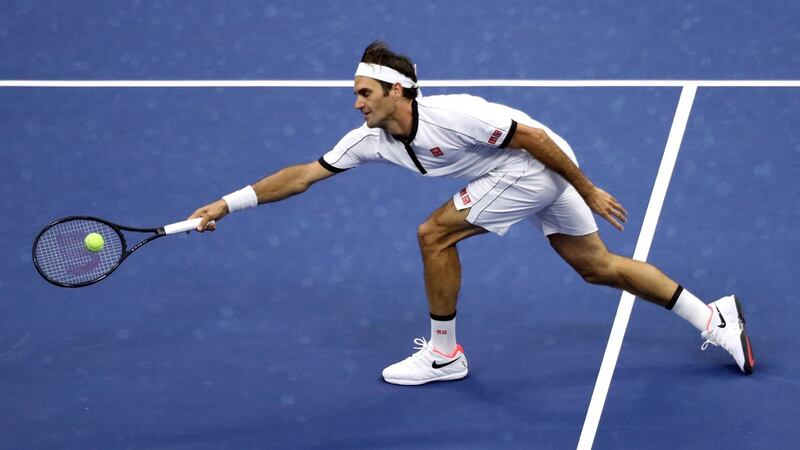 Roger Federer reaches to return a shot against Damir Dzumhur during their men’s singles second-round match at the US Open at Flushing Meadows. Photograph: Katharine Lotze/Getty Images