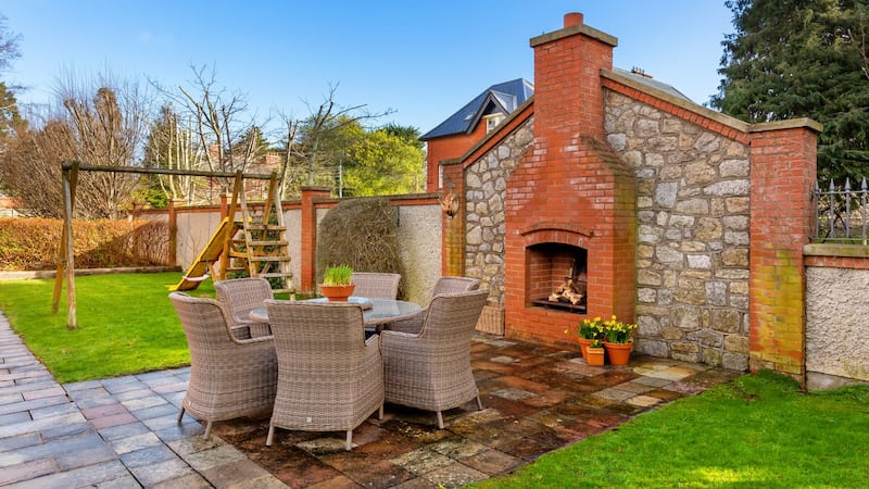Outdoor fireplace in back garden