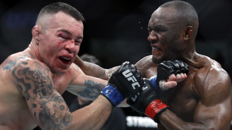 Colby Covington takes a punch from UFC welterweight champion Kamaru Usman in their welterweight title fight last December in Las Vegas. Photograph: Steve Marcus/Getty Images