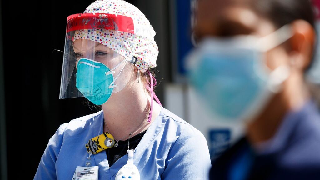 Nurses gather for a strike about their lack of personal protective equipment (PPE) outside a hospital in New York. The city is the epicentre of the coronavirus outbreak in the US. Photograph: Justin Lane/EPA