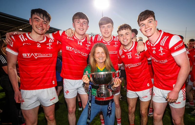 Micheál Reid, Dylan Shevlin, Ryan Shevlin, Adam Gillespie and Keelin Martin celebrate with their teacher Bridget Smith after Louth won the Leinster under-20 football title. Photograph: Ryan Byrne/Inpho