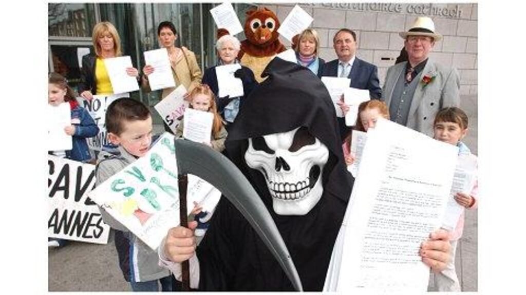 Residents who live near St Anne's Park, Raheny, protesting outside Dublin City Council yesterday before handing in 4,500 signatures against the city manager's plan to rezone part of the park for industrial use to allow for the development of a green waste-shredding and recycling facility.