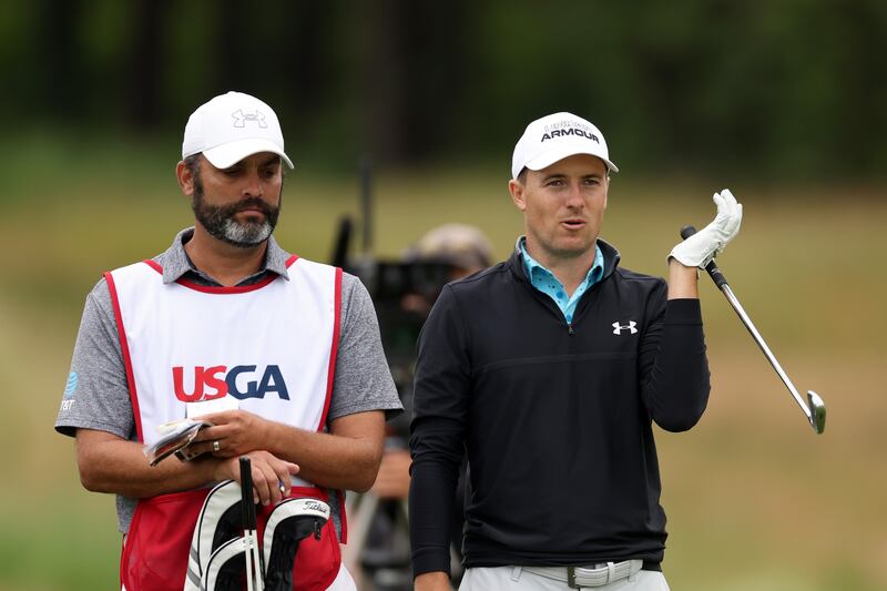 Jordan Spieth waits with caddie Michael Greller before hitting an approach shot on the 15th hole during round one of the 122nd US Open Championship at The Country Club in Brookline, Massachusetts. Photograph: Rob Carr/Getty Images