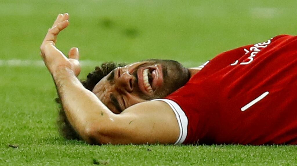 Liverpool’s Mohamed Salah reacts after sustaining an injury in the Champions League final. Photograph: Reuters