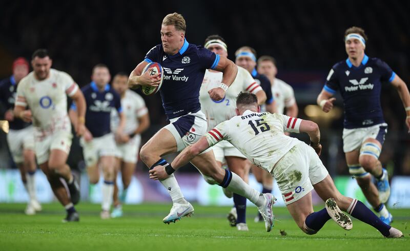 Duhan van der Merwe of Scotland goes past Freddie Steward of England as he scores a sensational individual try in the victory over England at Twickenham. Photograph: David Rogers/Getty Images